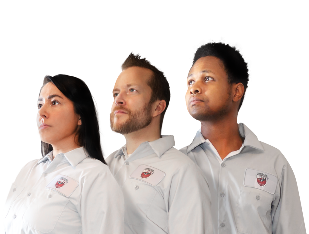 A group of employees standing together, looking off into the distance with stoic expressions