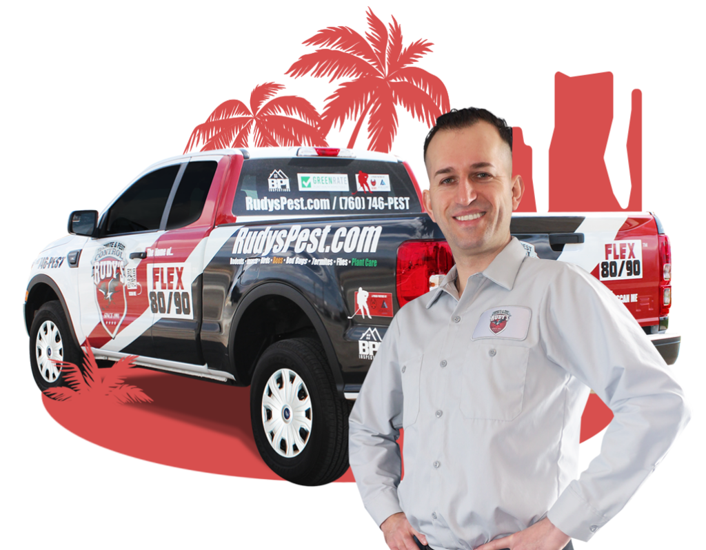 Employee smiling in front of a Rudy's Pest Control Vehicle.