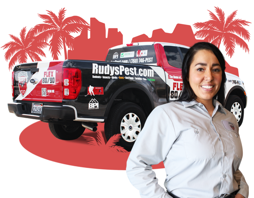 Employee smiling in front of a Rudy's Pest Control Vehicle.