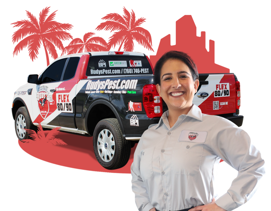 Employee smiling in front of a Rudy's Pest Control Vehicle.