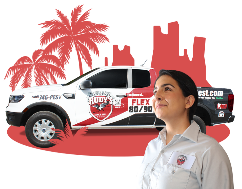 Employee smiling in front of a Rudy's Pest Control Vehicle.